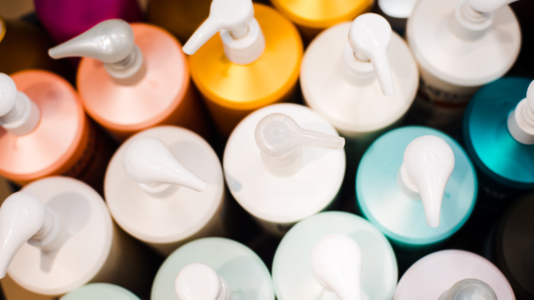 Multicolored bottles of shampoos and conditioners