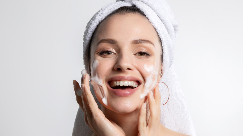 woman washing her face