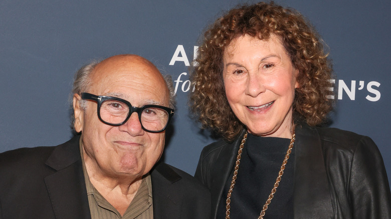 Danny DeVito and Rhea Perlman smiling while posing together