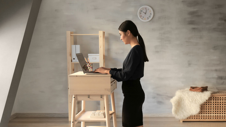 Woman standing at a desk