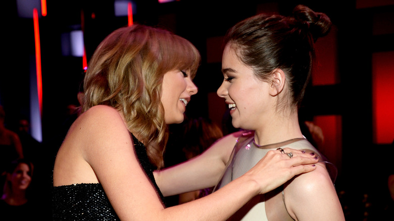 Taylor Swift and Hailee Steinfeld sharing a laugh