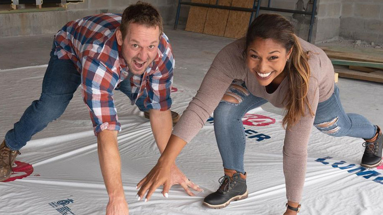 Brian and Mika Kleinschmidt posing construction site