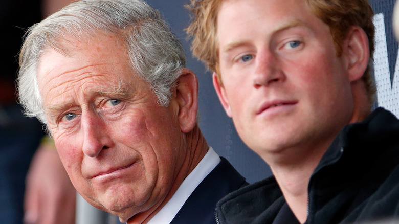 Prince Harry and Prince Charles at an event. 