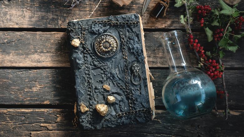 Book and potion on table