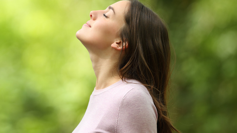 A woman breathing fresh air