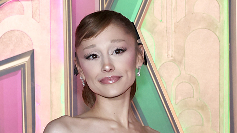 Ariana Grande tilting her head and smirking