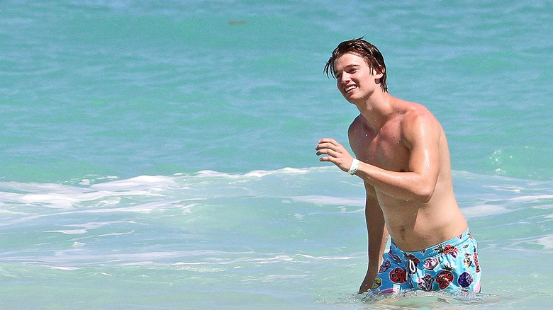 Patrick Schwarzenegger smiling on the beach in Miami in 2012.