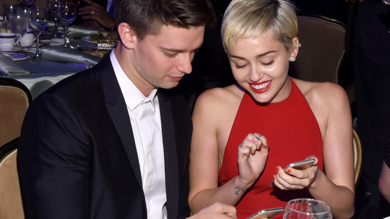 Patrick Schwarzenegger and Miley Cyrus getting cozy over dinner.