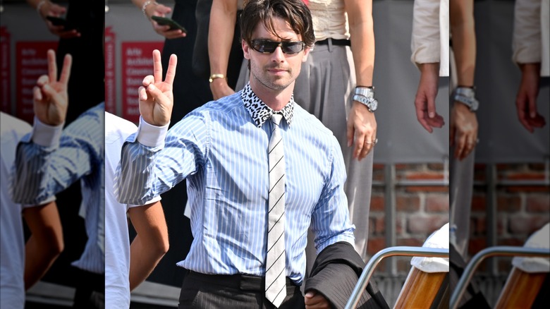 Patrick Schwarzenegger making a peace sign while out in Venice.