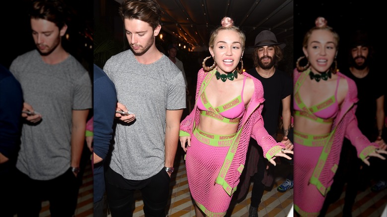 Patrick Schwarzenegger and Miley Cyrus walking together in Miami.