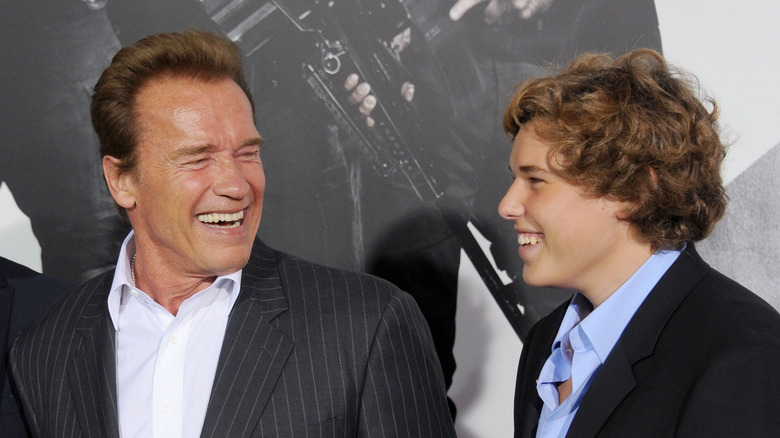 Arnold and Christopher Schwarzenegger laugh together