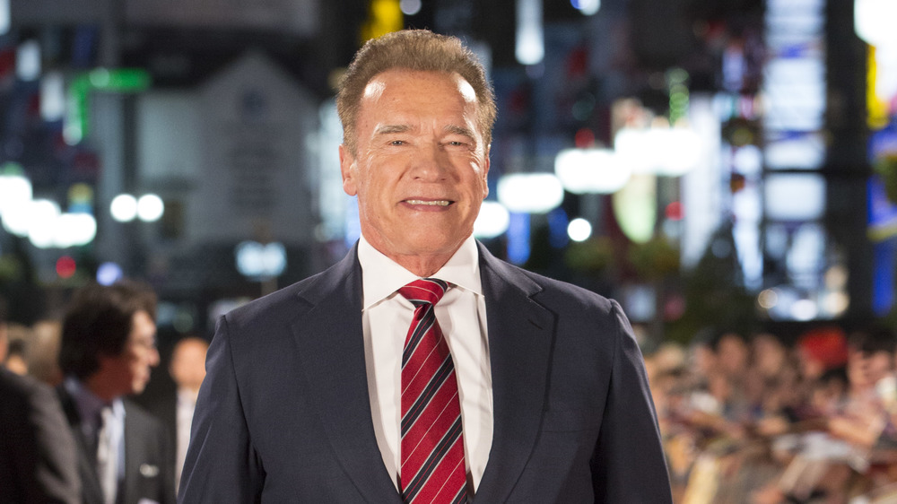 Arnold Schwarzenegger in a red tie