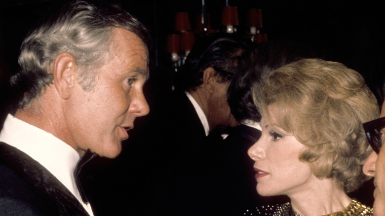 Tonight Show host Johnny Carson greets comedienne Joan Rivers and her Husband Edgar Rosenberg at the party after taping the 10th anniversary show on September 30 1972 in Los Angeles, California.