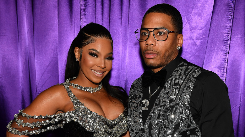 Ashanti and Nelly posing at an event