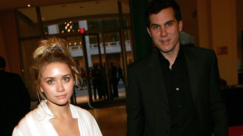 Ashley Olsen and Scott Sartiano pose for a photo