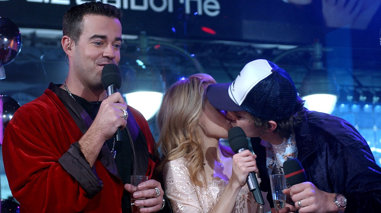 Carson Daly in a red robe next to Brittany Murphy and Ashton Kutcher kissing in pajamas