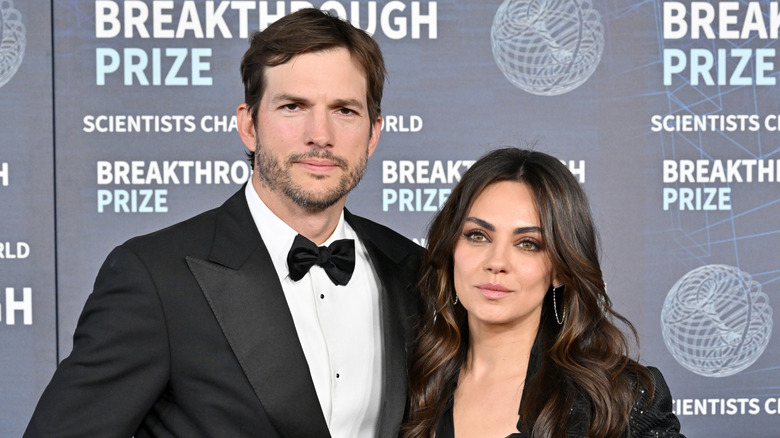 Ashton Kutcher and Mila Kunis in black