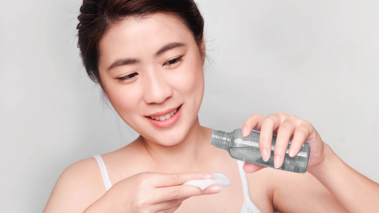 woman applying toner 