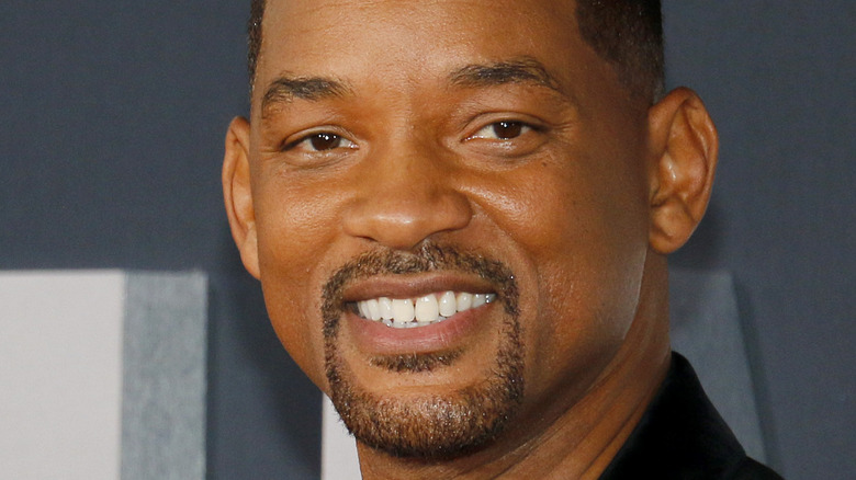 Will Smith flashes a grin at the premiere of "Gemini Man"