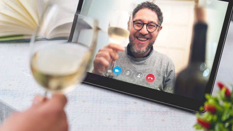 Folks drinking white wine on virtual visit