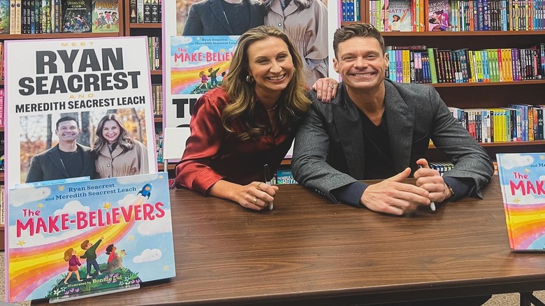 Ryan Seacrest and Meredith Seacrest Leach sitting at a table