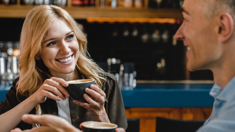 Woman and man having coffee