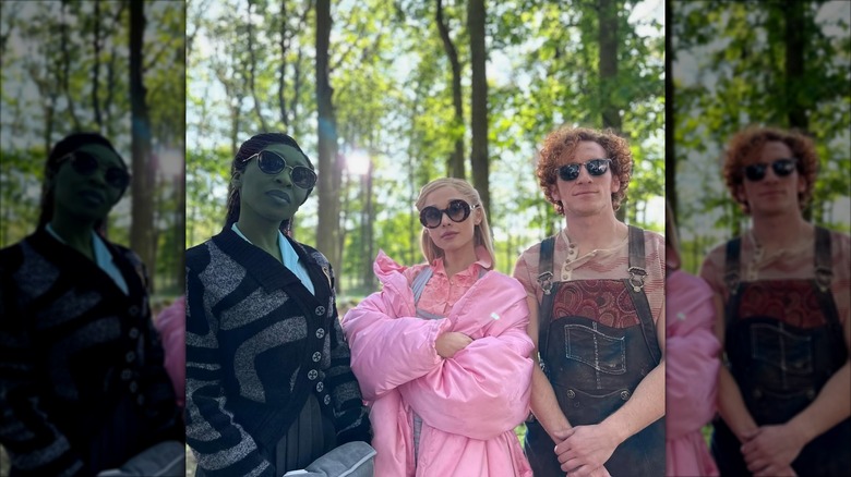 Cynthia Erivo, Ariana Grande, and Ethan Slater pose in the woods