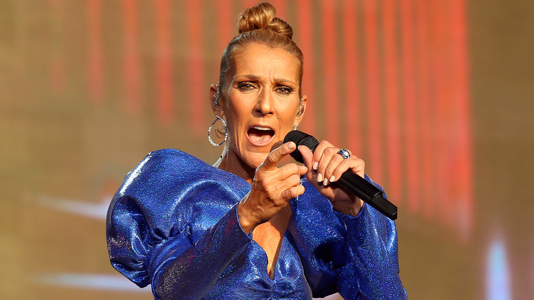 Celine Dion singing into mic