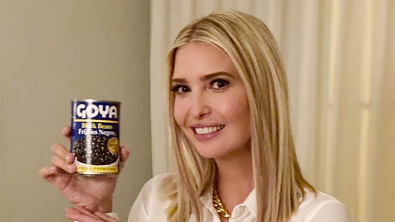 Ivanka Trump smiling and presenting a can of Goya beans