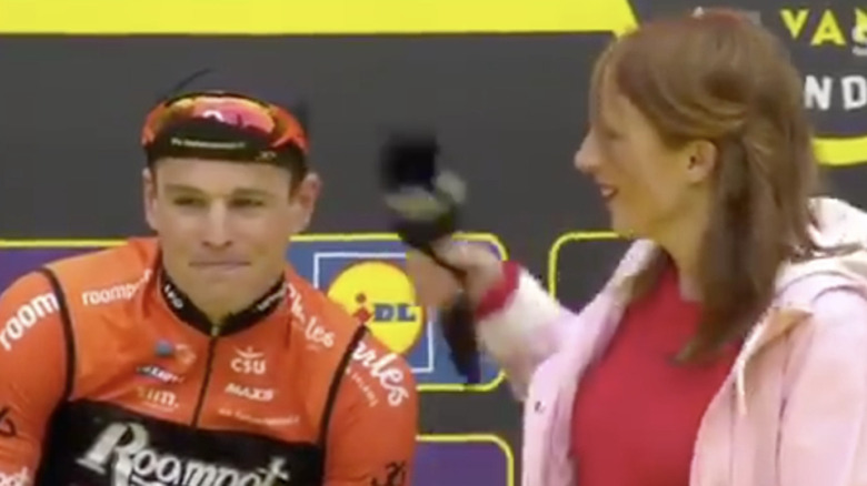 Belgian cyclist kissing reporter