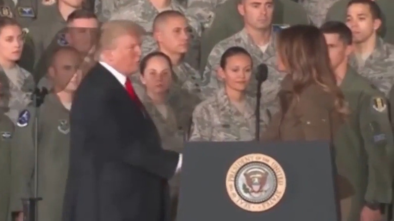 Donald Trump and Melania Trump shaking hands