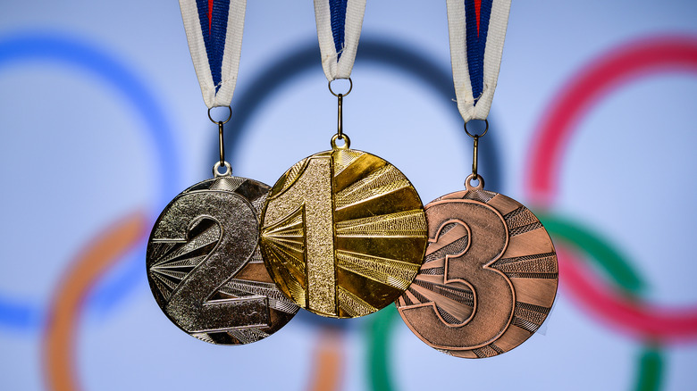 Olympic rings and gold, silver, bronze medals