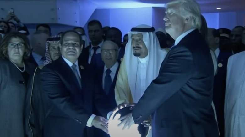President Abdel Fatah al-Sissi, King Salman, and President Donald Trump touched a glowing orb