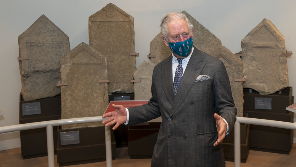 Prince Charles walking in mask 