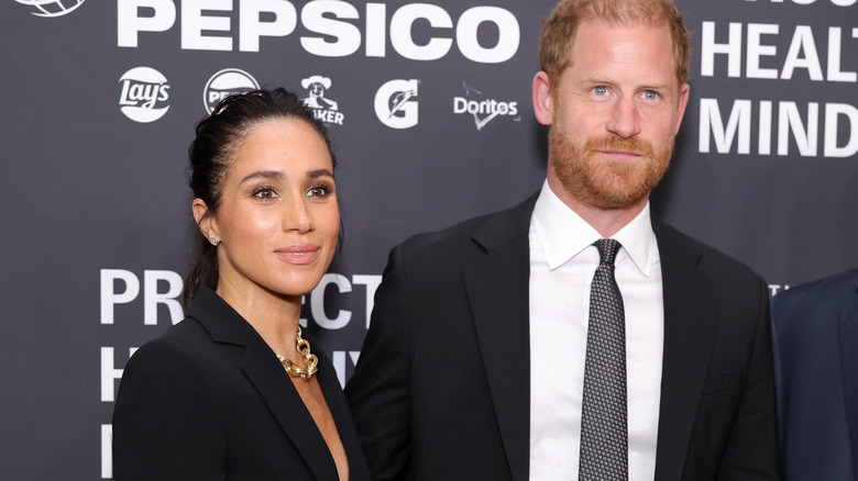 Meghan Markle and Prince Harry posing for the cameras