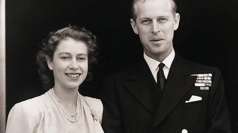 Queen Elizabeth II and Prince Philip smiling for the camera