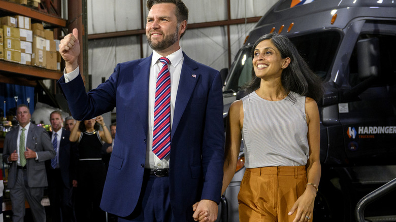 JD Vance and Usha Vance holding hands and smiling
