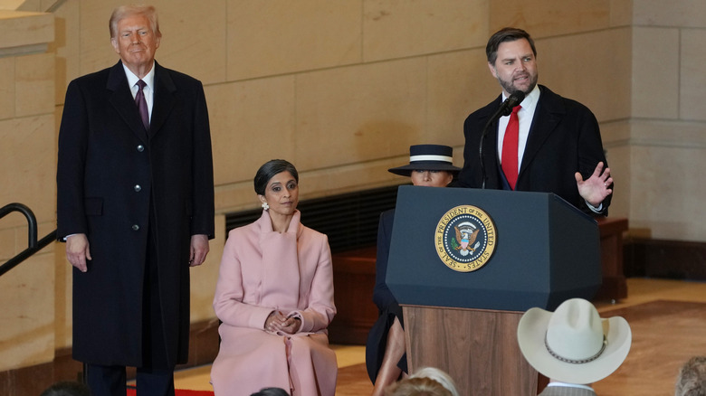 Donald Trump, Melania Trump, and Usha Vance listening to J.D. Vance speaking at Trump's second inauguration