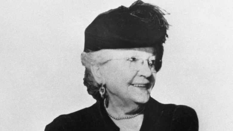 Laura Ingalls Wilder with glasses and black hat