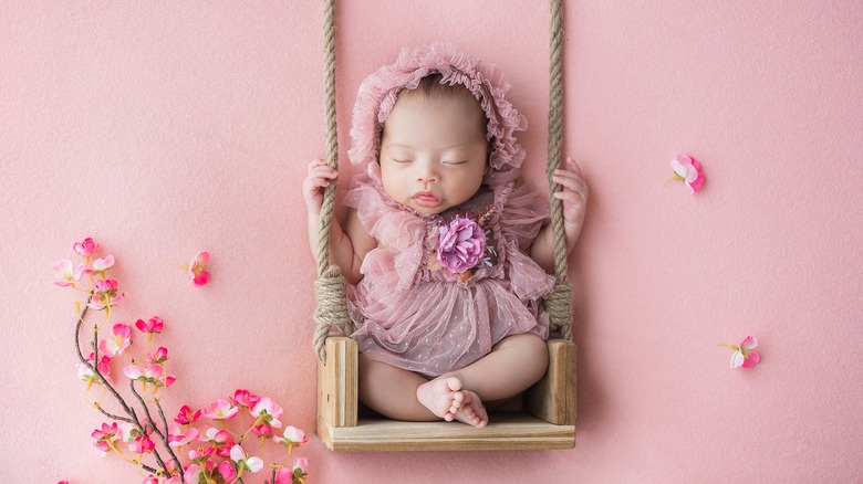 Baby surrounded by flowers