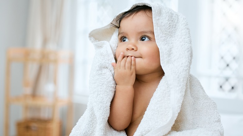 Baby under a towel