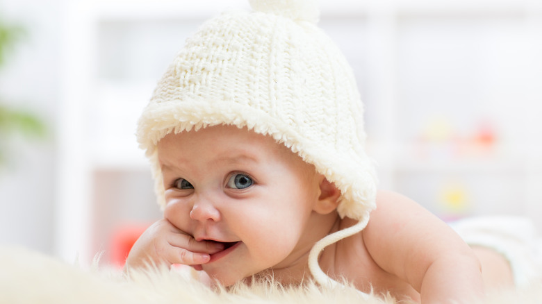 cute baby with blue eyes and hat