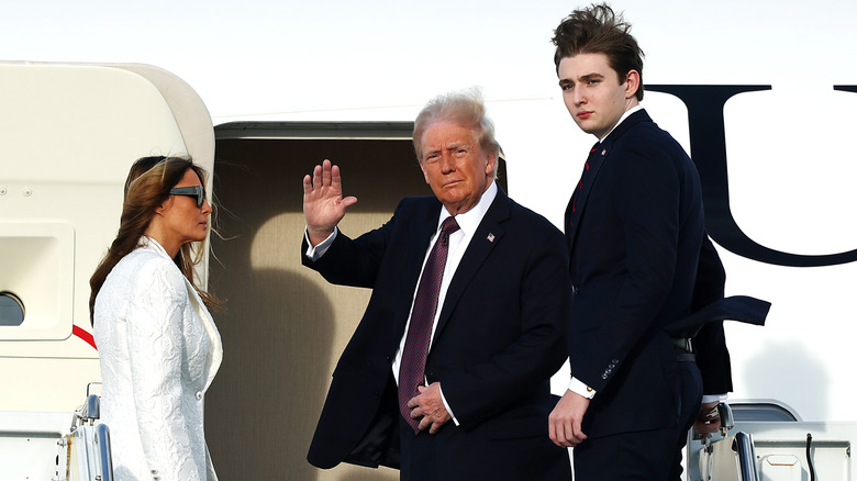 Donald Trump, Melania Trump and their son Barron board a U.S. Air Force aircraft en route to Dulles, Virginia on January 18, 2025.