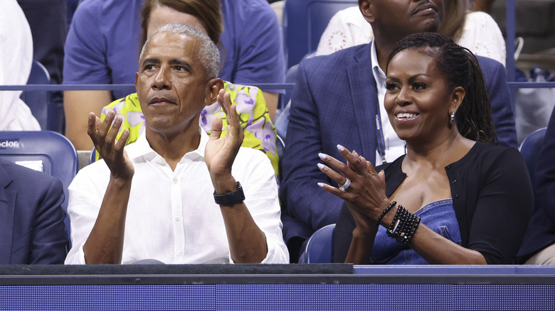 Barack and Michelle Obama clapping