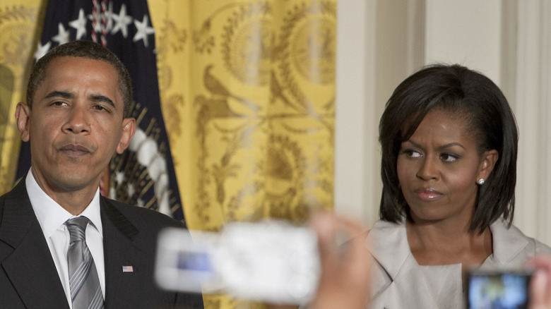 Barack and Michelle Obama being photographed at The White House