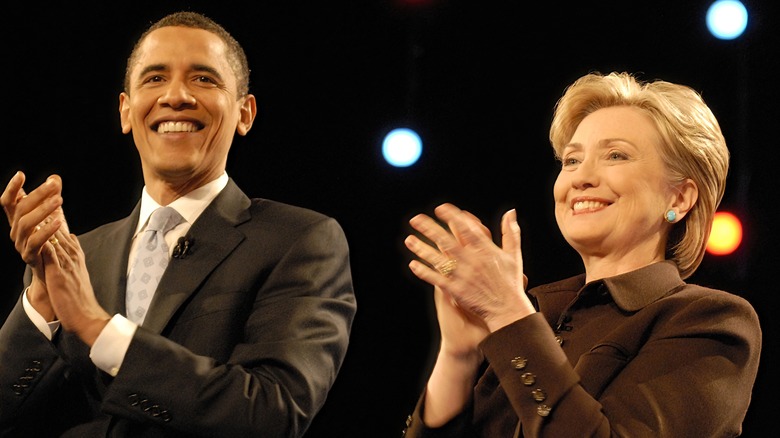 Barack Obama and Hillary Clinton applauding