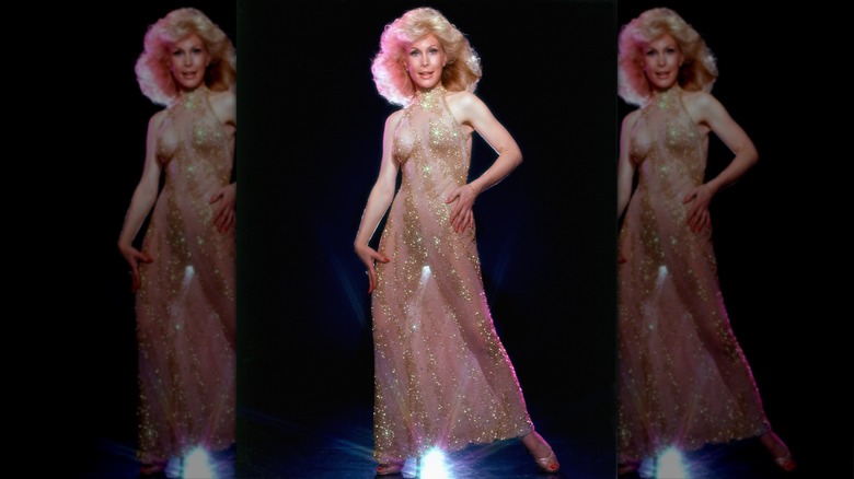 Barbara Eden posing in a sheer gold dress