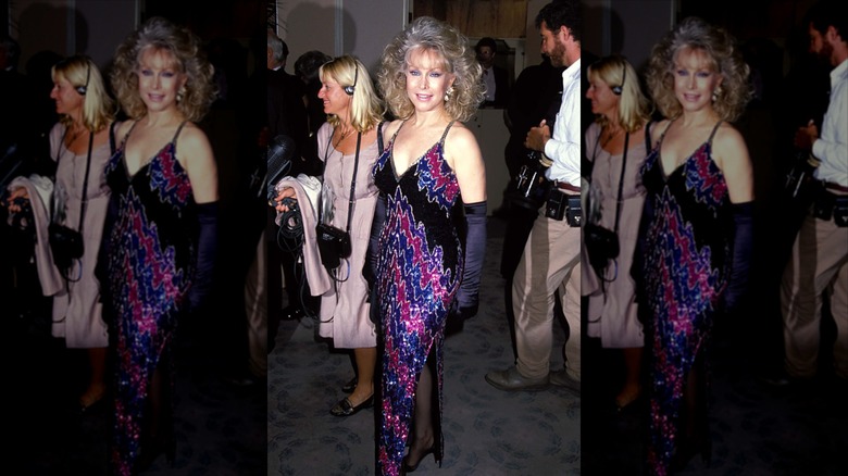 Barbara Eden posing in a printed gown