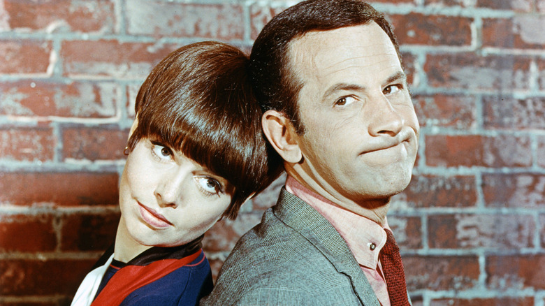 Don Adams and Barbara Feldon smiling in a 1960s portrait for "Get Smart"