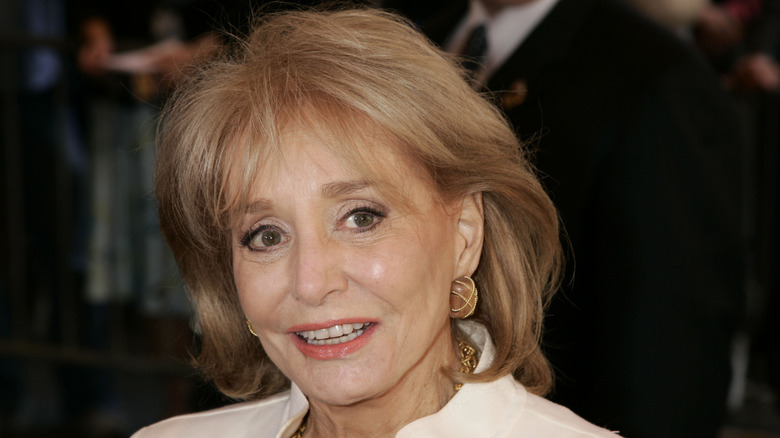 Barbara Walters posing for photos